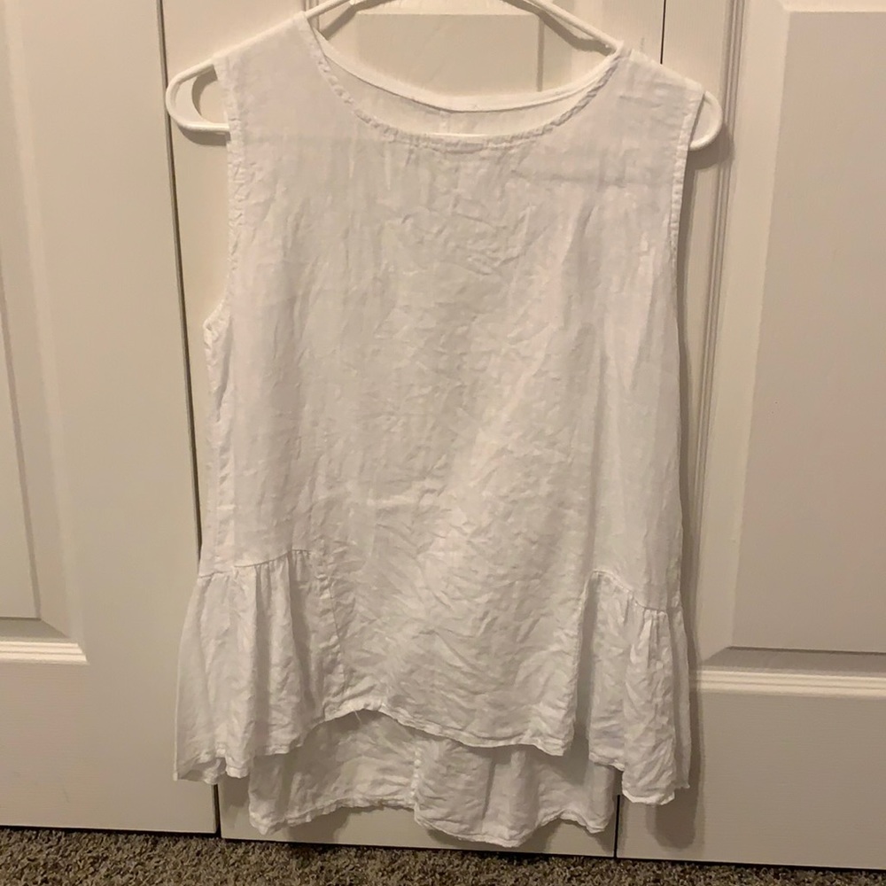 White tank, worn a couple times. Tag cut out because it was itchy.